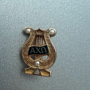 ALPHA Chi Omega pins gold